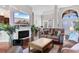 Bright living room featuring a fireplace, TV, and comfortable seating for relaxing and entertaining at 9060 Abingdon Dr., Myrtle Beach, SC 29579