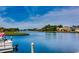 Scenic water view showing lush green shoreline, clear blue sky, and waterfront properties at 9060 Abingdon Dr., Myrtle Beach, SC 29579