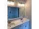 Bathroom with a large mirror over a double sink vanity, plus shower at 907 Inlet Keys St., Murrells Inlet, SC 29576