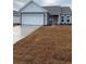 Single-story home featuring vinyl siding, a two-car garage, and a well-maintained lawn at 907 Inlet Keys St., Murrells Inlet, SC 29576