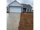 Single-story home featuring vinyl siding, a two-car garage, and a well-maintained lawn at 907 Inlet Keys St., Murrells Inlet, SC 29576