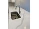Close-up of kitchen sink with modern faucet and quartz countertop at 907 Inlet Keys St., Murrells Inlet, SC 29576