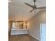 Open concept living room and kitchen with pendant lighting, vaulted ceiling, and hard surface floors at 907 Inlet Keys St., Murrells Inlet, SC 29576