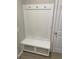 Mudroom entryway with white coat rack, bench, and ample storage space at 907 Inlet Keys St., Murrells Inlet, SC 29576