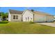 Back exterior view featuring a well-maintained lawn and an attached garage at 908 Oglethorpe Dr., Conway, SC 29527