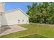 Back exterior view featuring a well-maintained lawn and a concrete patio at 908 Oglethorpe Dr., Conway, SC 29527