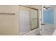 Bright bathroom featuring a tub with sliding glass doors and an open view to another room at 908 Oglethorpe Dr., Conway, SC 29527