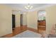 Open dining area with hardwood floors and archways to living areas, creating a bright and inviting space at 908 Oglethorpe Dr., Conway, SC 29527