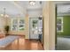 Bright foyer with hardwood floors leading to sunlit rooms, adjacent to an open doorway at 908 Oglethorpe Dr., Conway, SC 29527