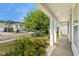 Inviting front porch view, framed by large columns, offers a serene neighborhood perspective at 908 Oglethorpe Dr., Conway, SC 29527