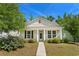 Charming single-story home with a well-manicured lawn, sidewalk, and inviting front porch at 908 Oglethorpe Dr., Conway, SC 29527