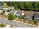 Charming homes with well-manicured lawns, inviting front porches, and neatly lined sidewalks creating a welcoming street view at 908 Oglethorpe Dr., Conway, SC 29527