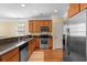 Bright kitchen with wooden cabinets, stainless steel appliances, and a granite countertop at 908 Oglethorpe Dr., Conway, SC 29527