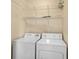 Laundry room with a washer, a dryer, and wire shelving for storage at 908 Oglethorpe Dr., Conway, SC 29527