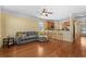 Cozy living room with hardwood floors, open to a kitchen bar, and a comfortable grey couch at 908 Oglethorpe Dr., Conway, SC 29527