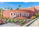 Inviting 'Welcome to Conway' brick sign featuring manicured landscaping, palm trees, and a vibrant display at 908 Oglethorpe Dr., Conway, SC 29527