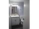 Bathroom with updated vanity, mirror, and toilet, painted with gray walls at 950 Forestbrook Rd. # C3, Myrtle Beach, SC 29579