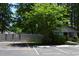 Exterior view featuring a parking area, privacy fence and tidy landscaping around the community at 950 Forestbrook Rd. # C3, Myrtle Beach, SC 29579