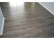 Close-up of newly installed dark gray wood floors adding warmth to this home at 950 Forestbrook Rd. # C3, Myrtle Beach, SC 29579