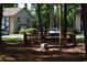 Wooden gazebo with benches, set amongst trees, near well-kept buildings and parking at 950 Forestbrook Rd. # C3, Myrtle Beach, SC 29579