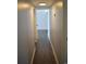Hallway with wood floor and neutral paint leads to a bright room at 950 Forestbrook Rd. # C3, Myrtle Beach, SC 29579