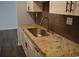 New kitchen featuring granite countertops, stainless steel sink, and stylish brown tile backsplash at 950 Forestbrook Rd. # C3, Myrtle Beach, SC 29579