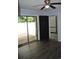 Light-filled living room features sliding glass doors to patio and a ceiling fan at 950 Forestbrook Rd. # C3, Myrtle Beach, SC 29579