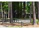 Recreation area with picnic tables, basketball hoop, and space for various activities, surrounded by trees at 950 Forestbrook Rd. # C3, Myrtle Beach, SC 29579