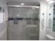 Bathroom featuring a luxurious glass door shower with intricate marble tiling at 9550 Shore Dr. # 1728, Myrtle Beach, SC 29572