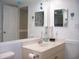 Bathroom features a vanity with mirror, nautical decor, and open doorway at 9550 Shore Dr. # 1728, Myrtle Beach, SC 29572
