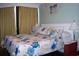Bedroom with turtle-themed bedding, bright lamps and decor with beachy accents at 9550 Shore Dr. # 1728, Myrtle Beach, SC 29572