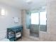 Bathroom with walk-in shower, blue vanity and tile flooring at 9820 Queensway Blvd. # 401, Myrtle Beach, SC 29572