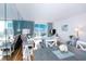 Cozy condo living and dining area with ocean views from the balcony at 9820 Queensway Blvd. # 401, Myrtle Beach, SC 29572