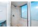 Inside the tile shower with a window and modern shower head at 9820 Queensway Blvd. # 401, Myrtle Beach, SC 29572