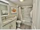 Bright bathroom features a granite vanity top, framed mirror, and a shower/tub combo with neutral accents at 9840 Queensway Blvd. # 1819, Myrtle Beach, SC 29572