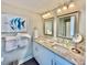 Bright bathroom featuring double sinks, granite countertops, and modern fixtures at 9840 Queensway Blvd. # 1819, Myrtle Beach, SC 29572