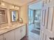 Bathroom with granite countertops leads into the primary bedroom and balcony at 9840 Queensway Blvd. # 1819, Myrtle Beach, SC 29572