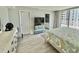 Bright bedroom with a TV, dresser, and balcony showcasing expansive views at 9840 Queensway Blvd. # 1819, Myrtle Beach, SC 29572