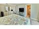 Spacious bedroom with a TV, dresser, and access to an ensuite bathroom at 9840 Queensway Blvd. # 1819, Myrtle Beach, SC 29572