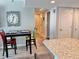 Dining area with table and chairs leads into a hallway at 9840 Queensway Blvd. # 1819, Myrtle Beach, SC 29572