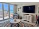 Comfortable condo living room with a walk-out balcony overlooking the ocean at 9840 Queensway Blvd. # 1819, Myrtle Beach, SC 29572