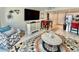 Comfortable condo living room with open kitchen and access to an outside balcony at 9840 Queensway Blvd. # 1819, Myrtle Beach, SC 29572