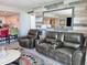 Condo living room showing open kitchen, comfortable seating, and decorative accents at 9840 Queensway Blvd. # 1819, Myrtle Beach, SC 29572