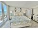 Bright primary bedroom with balcony access and ocean views at 9840 Queensway Blvd. # 1819, Myrtle Beach, SC 29572