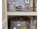 Water heater with clearly labeled piping and air conditioning system in a well-maintained closet at 9840 Queensway Blvd. # 1819, Myrtle Beach, SC 29572