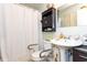 Accessible bathroom features a pedestal sink, built in shelving, and safety bars for the toilet at 1015 Elm St. # 18, Conway, SC 29526