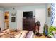 Well-appointed bedroom with a chest of drawers and a door to what looks like the primary bathroom at 1015 Elm St. # 18, Conway, SC 29526