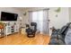 Comfortable living room with a large window, wood floors, and a modern entertainment center at 1015 Elm St. # 18, Conway, SC 29526