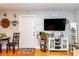 Open-concept living room features modern décor, a large television, and cozy dining area nearby at 1015 Elm St. # 18, Conway, SC 29526