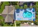 Top-down aerial perspective of a community pool with lounge chairs and lush landscaping at 104-4 Gully Branch Ln. # 4, Myrtle Beach, SC 29572